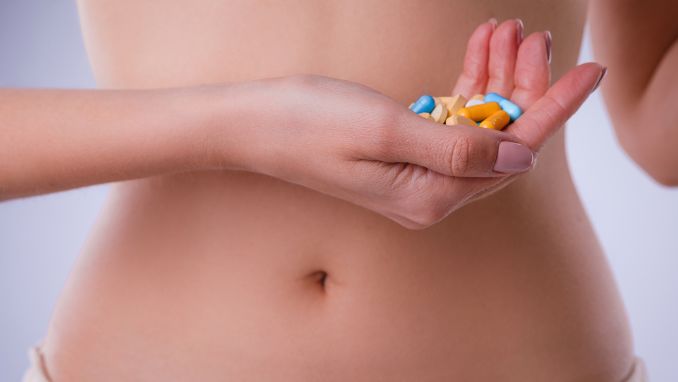 Acidophilus Health Benefits_ female-abdomen-pills-probiotics