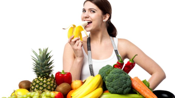 woman eating fruits and vegetables - Aip Diet Side Effects