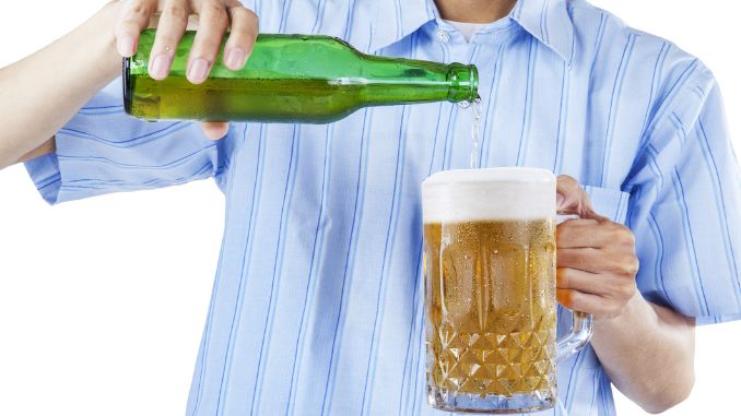 man-pouring-beer-glass